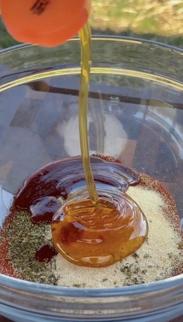 Chili lime marinade ingredients laid out including limes, chili powder, smoked paprika, honey, and garlic