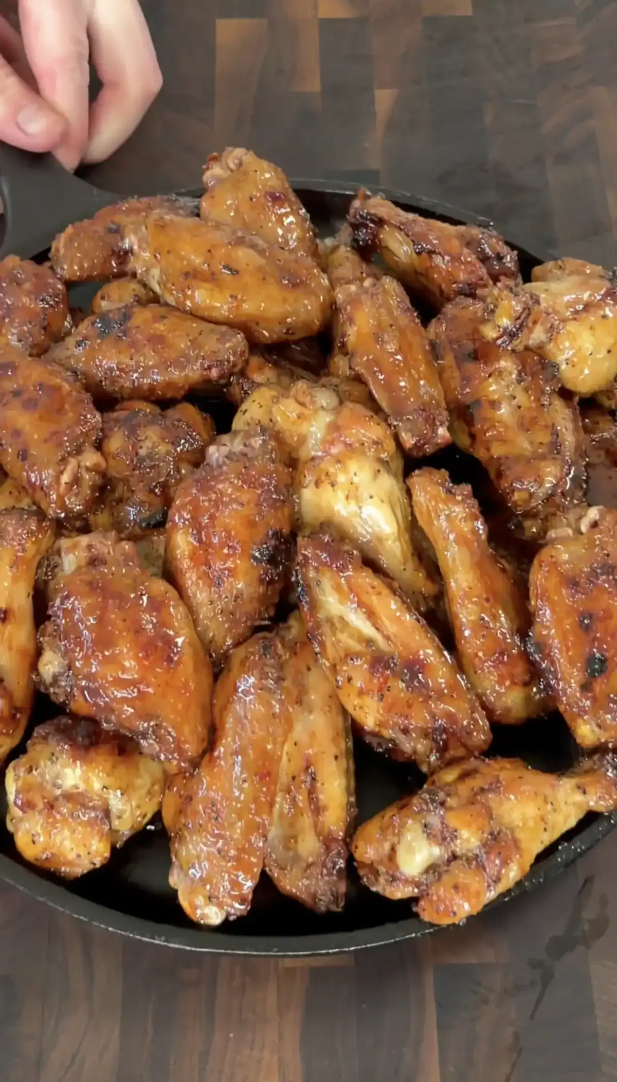 juicy pellet smoked chicken wings served on a plate.
