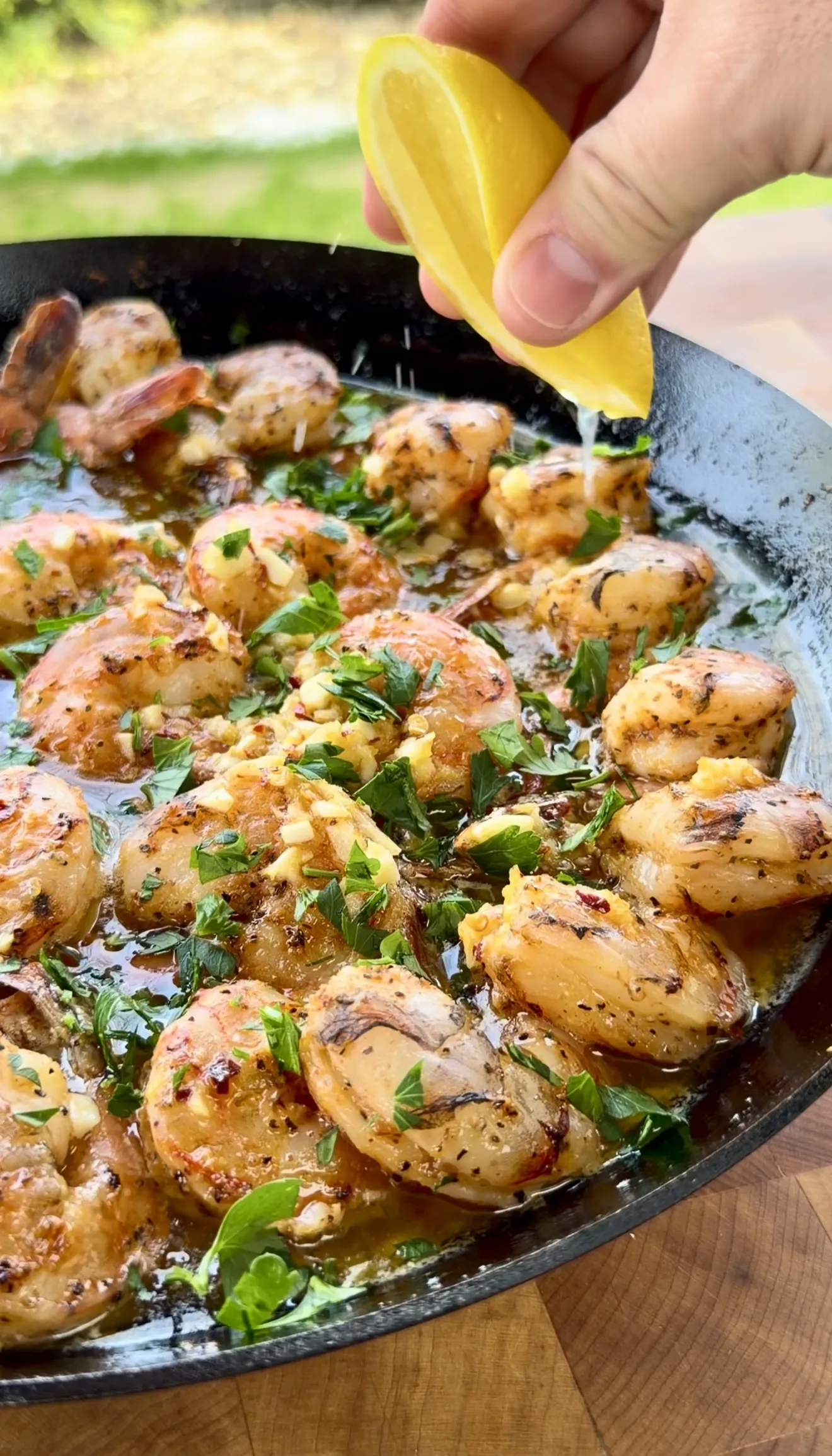 Garlic butter smoked shrimp served in a cast iron skillet