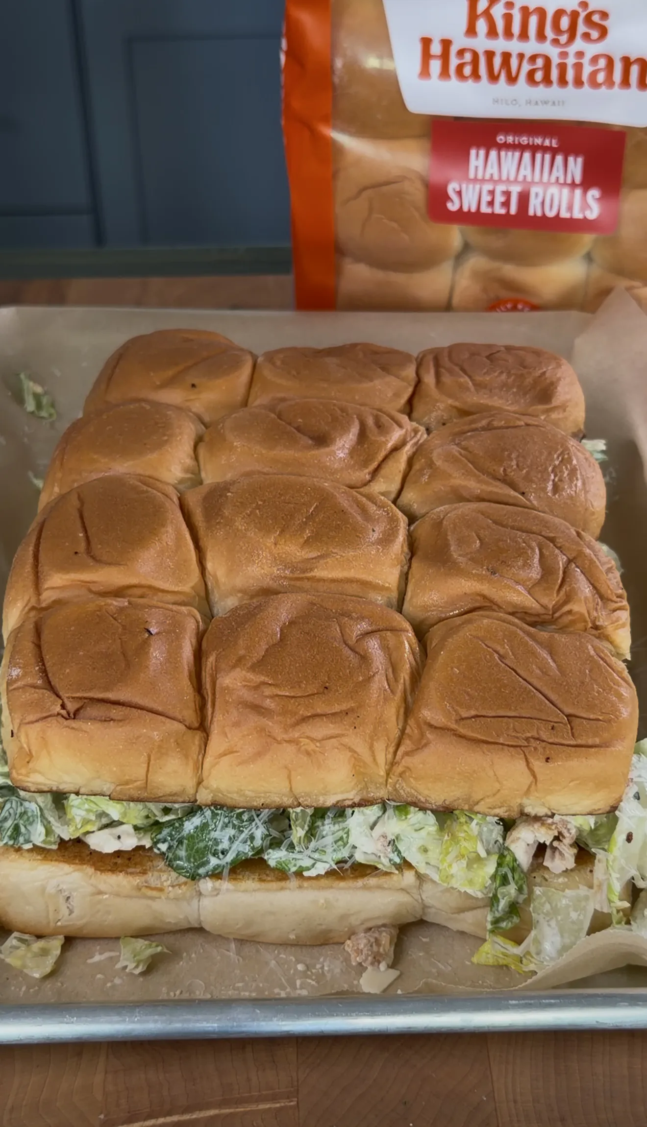 Assembled crispy chicken caesar sliders on Kings Hawaiian rolls