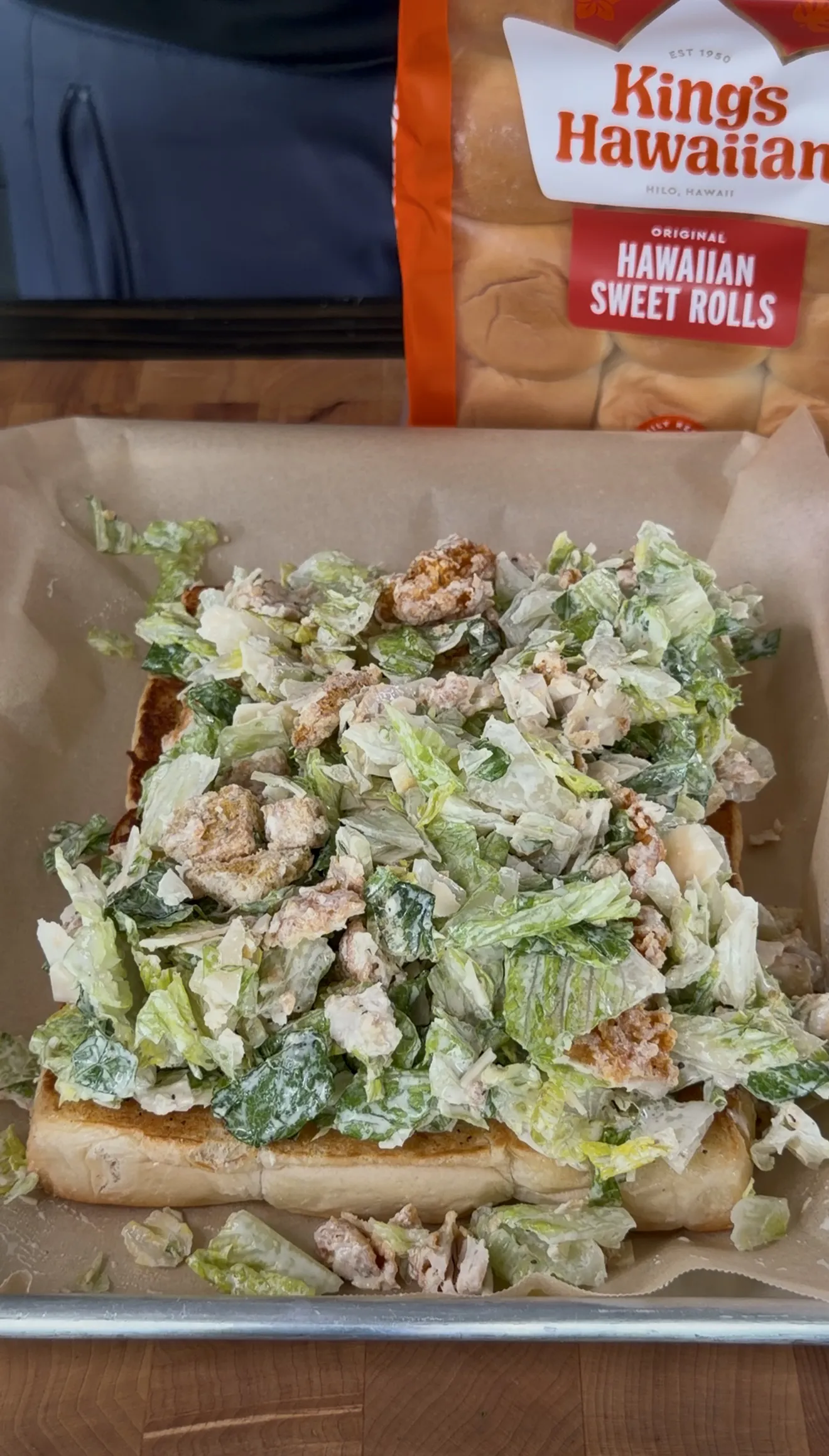 Crispy chicken caesar sliders on Kings Hawaiian rolls with parmesan and romaine