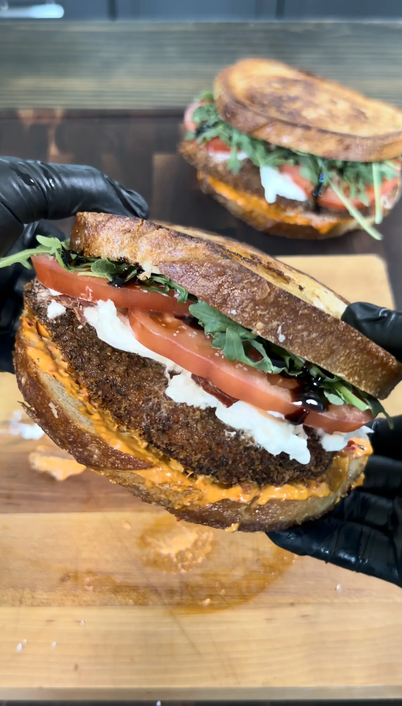 Crispy chicken cutlet sandwich on grilled sourdough with sides