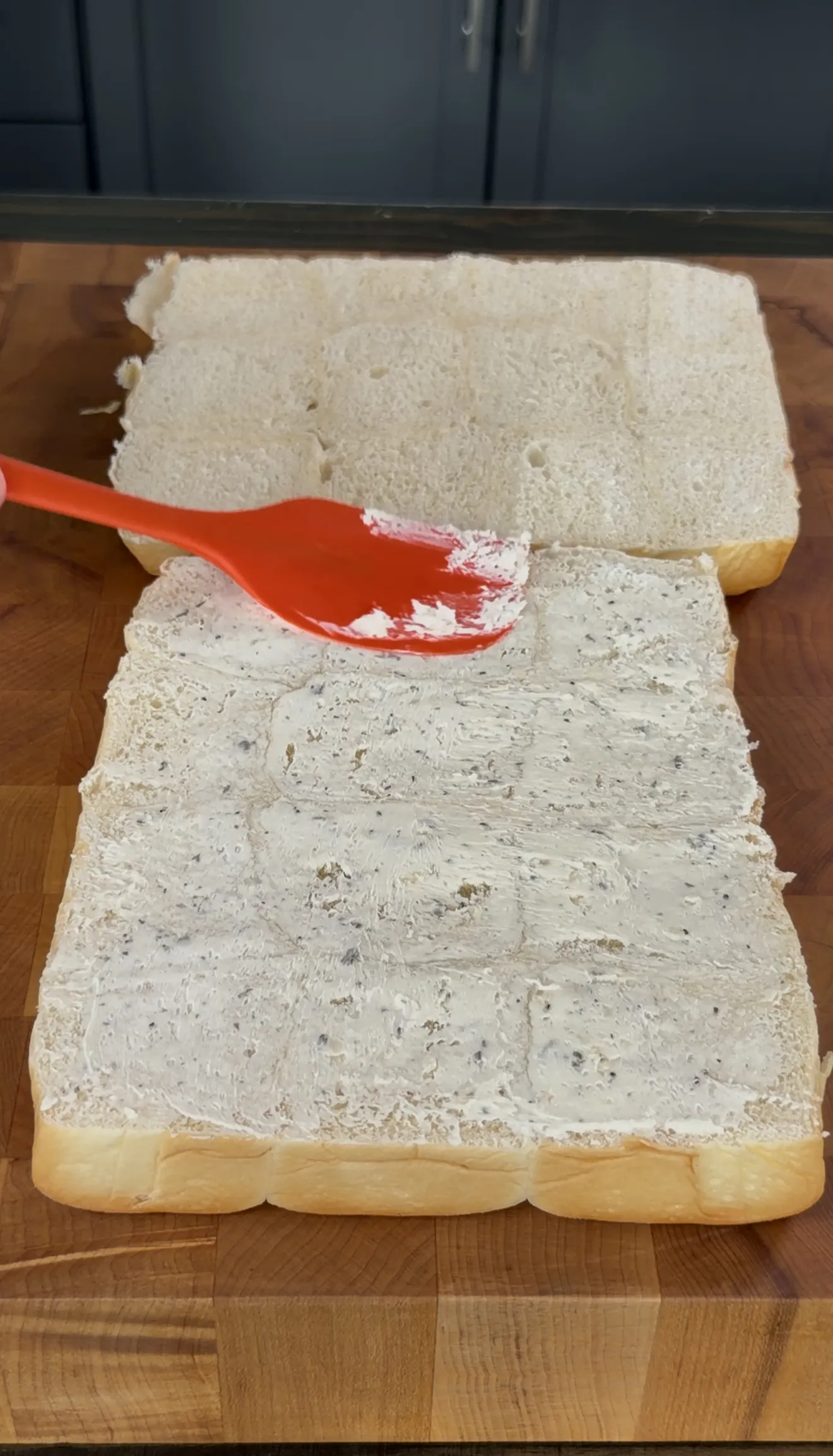 Slider buns brushed with garlic butter before toasting