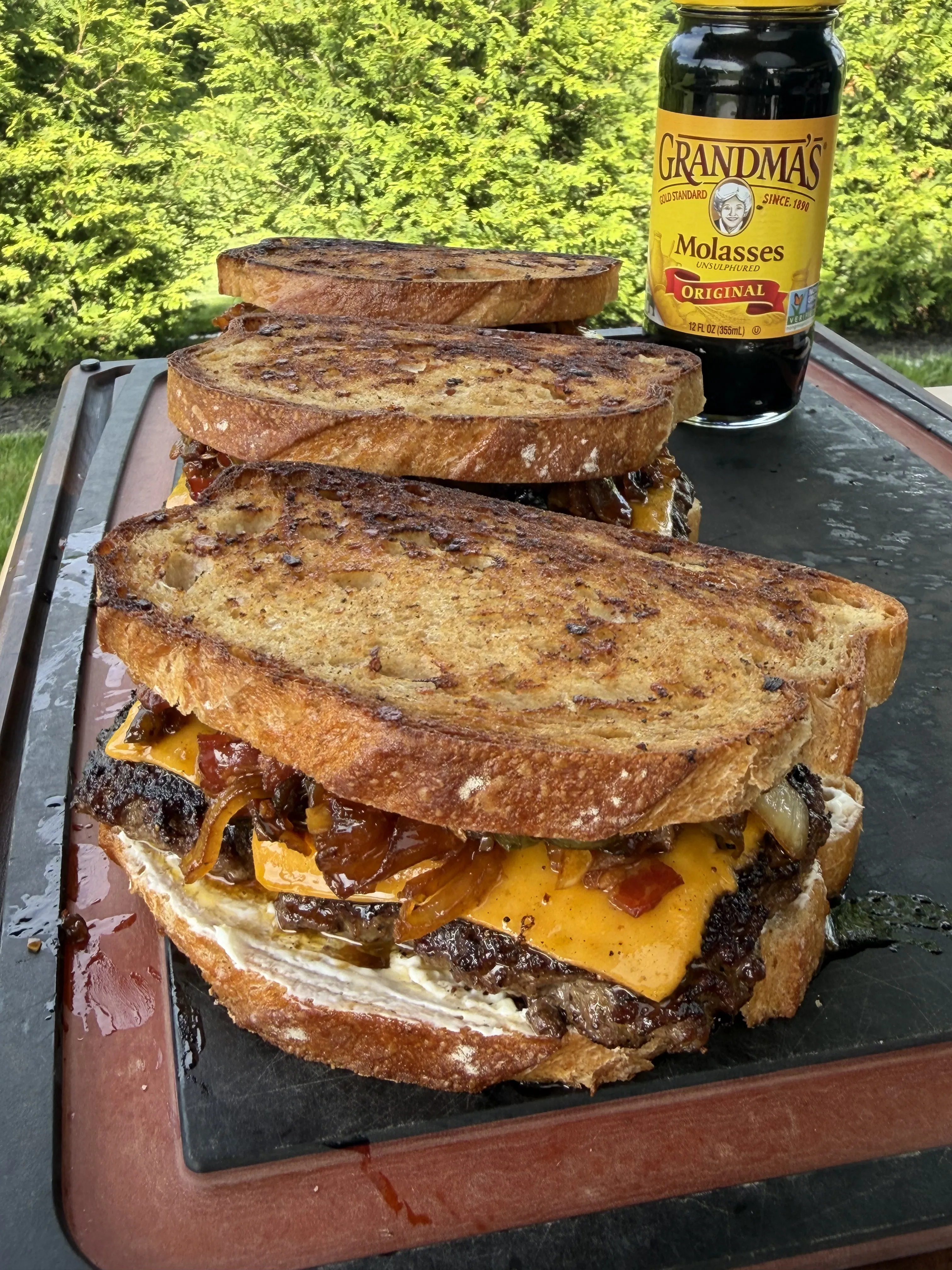 Finished bacon jam patty melt with melted cheese on toasted sourdough