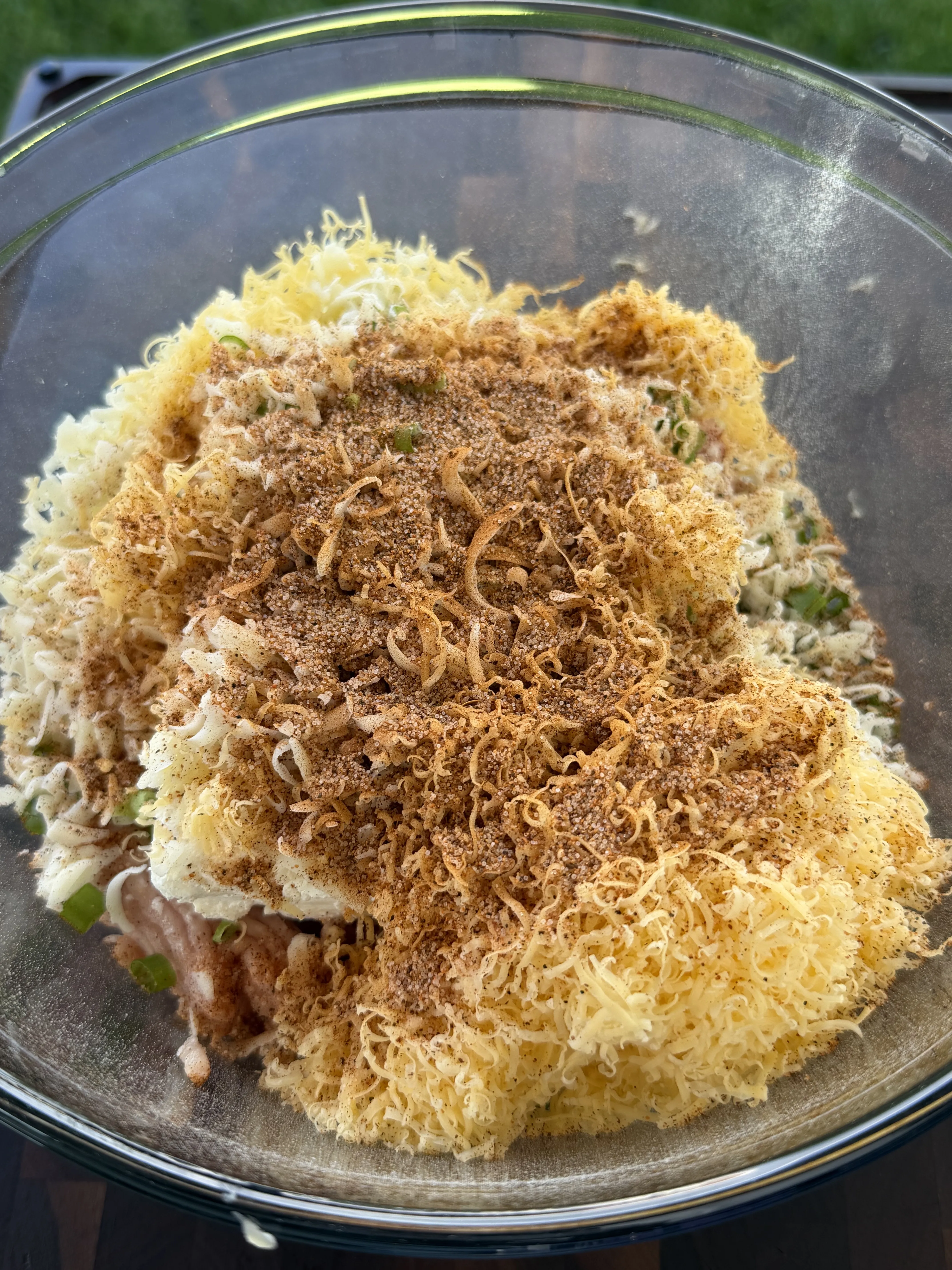 Buffalo chicken filling ingredients combined in a mixing bowl