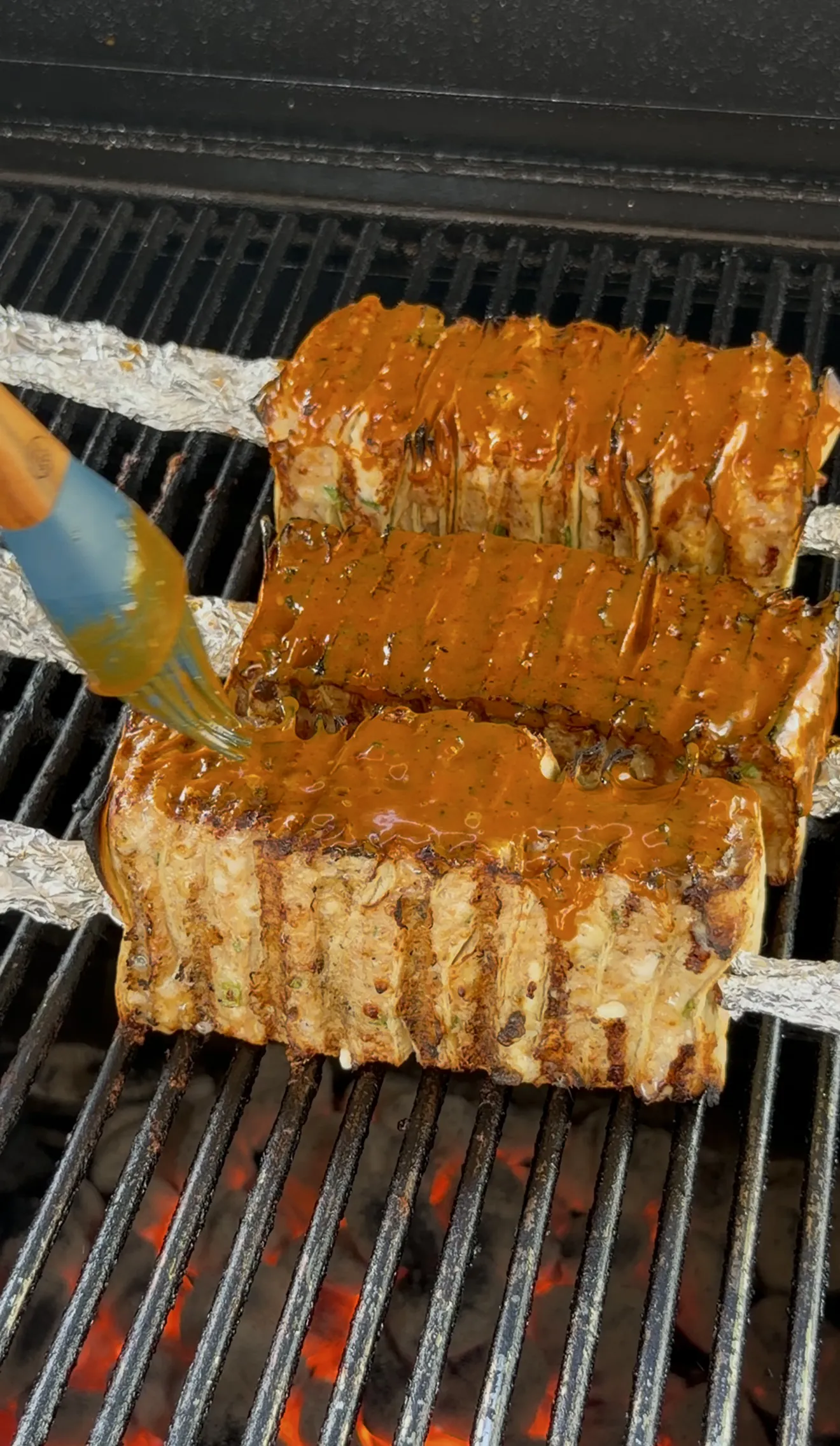 Buffalo chicken tortilla kebabs glazed and grilling toward 165 degrees internal
