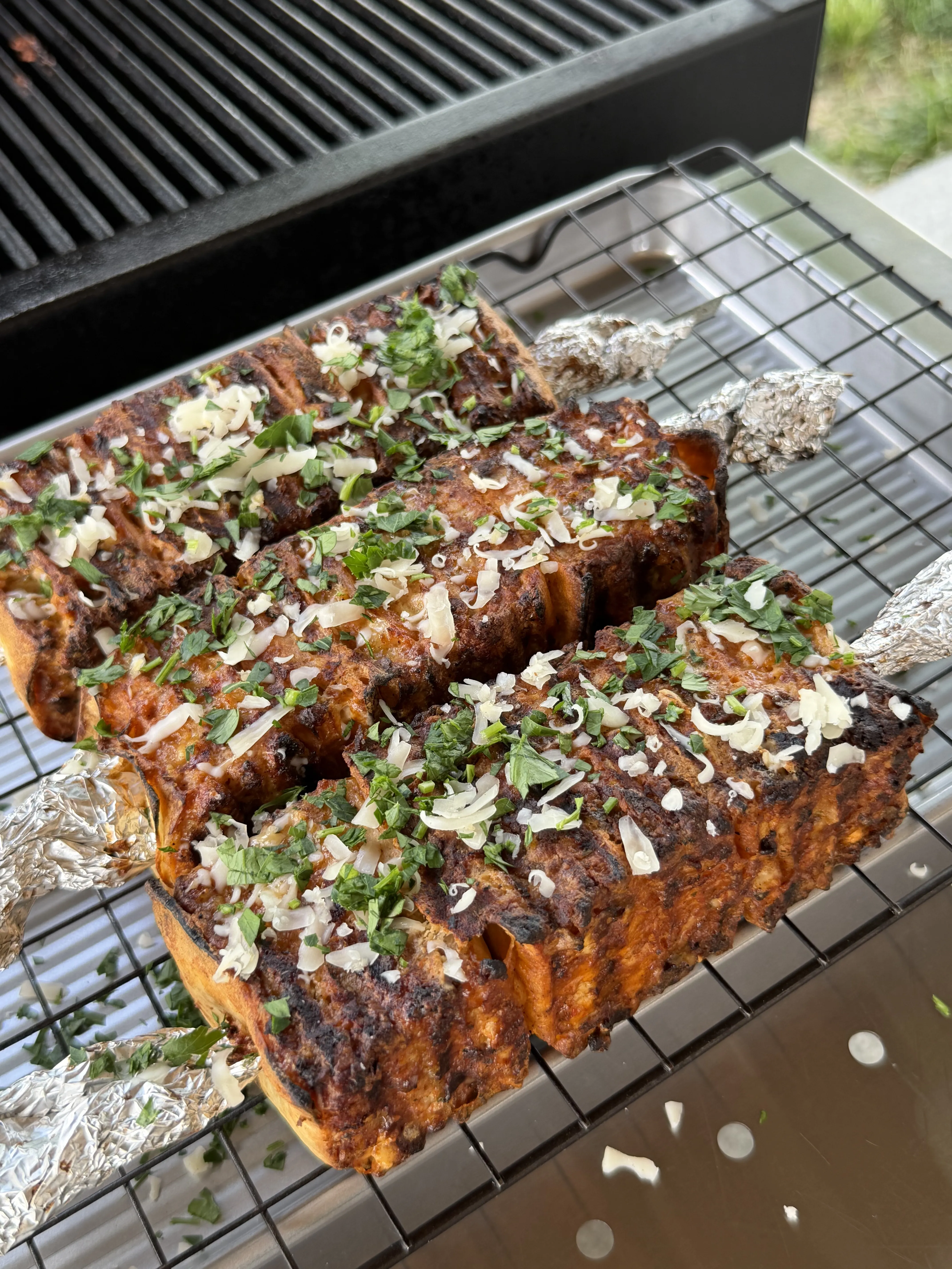 Grilled buffalo chicken tortilla kebabs topped with herbs and ready to serve