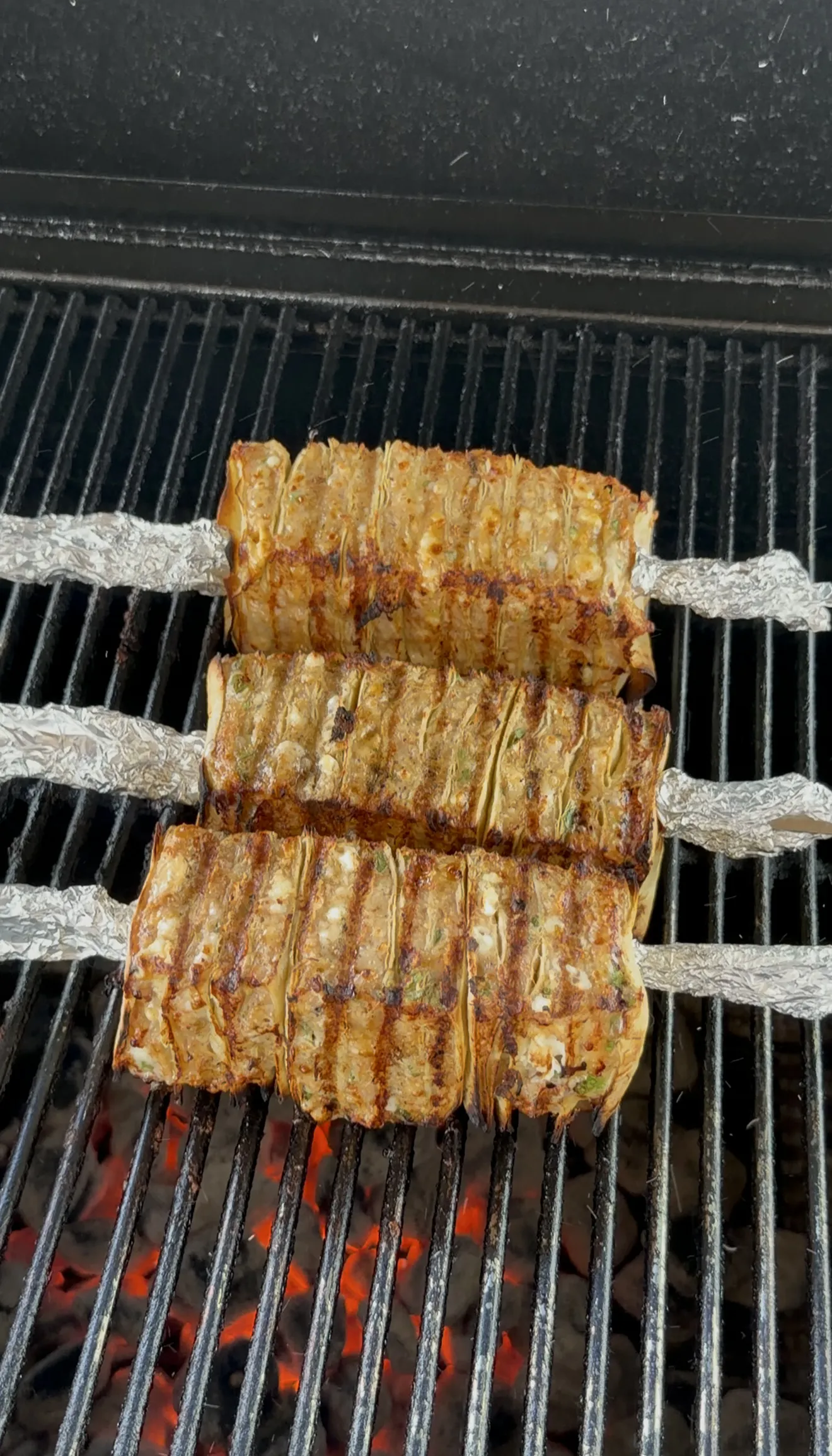 Buffalo chicken tortilla kebabs grilling over indirect heat