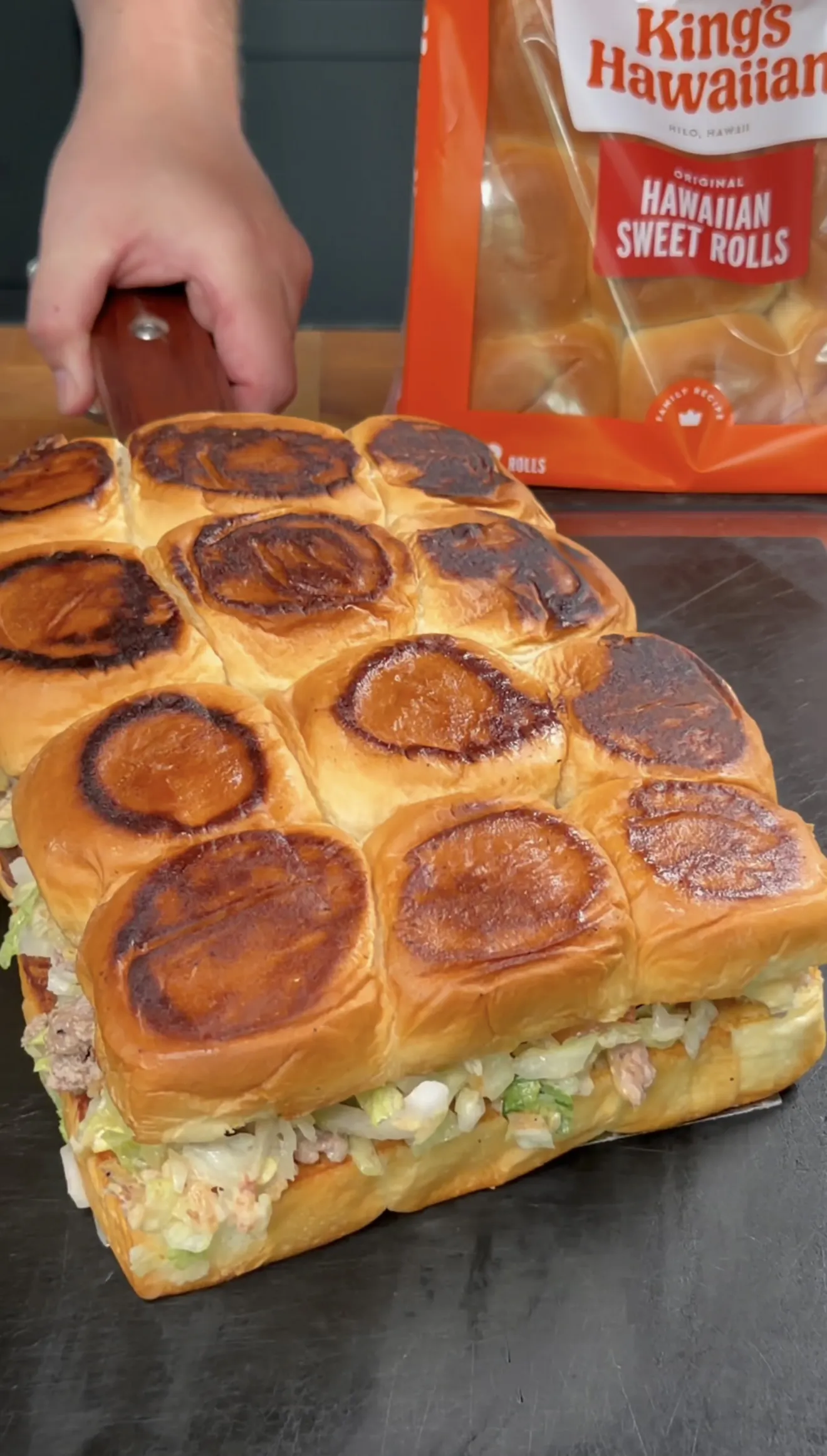 Chopped cheeseburger sliders on toasted King's Hawaiian rolls loaded with beef and lettuce