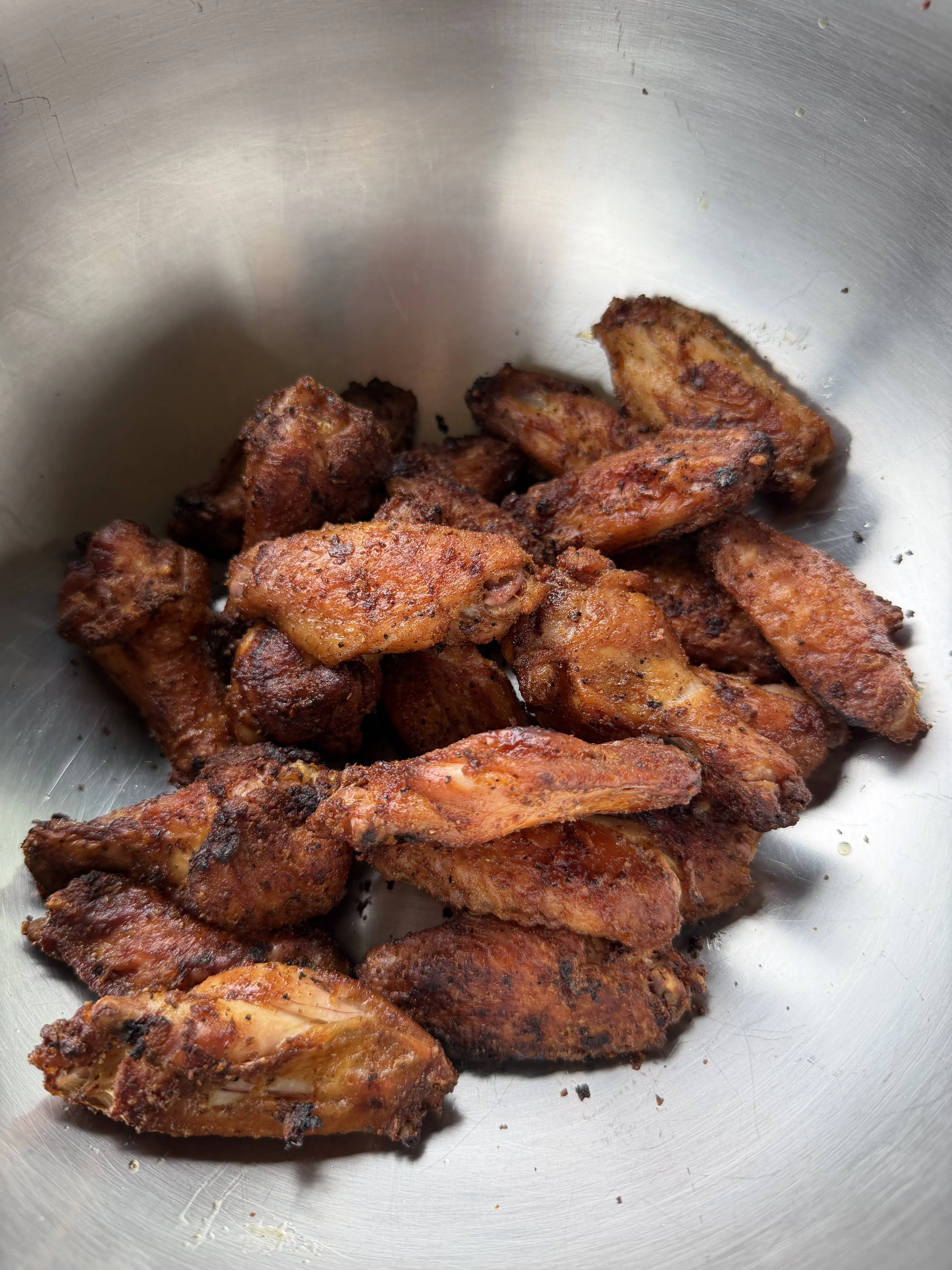 Crispy hot honey lemon pepper wings with caramelized coating ready to serve