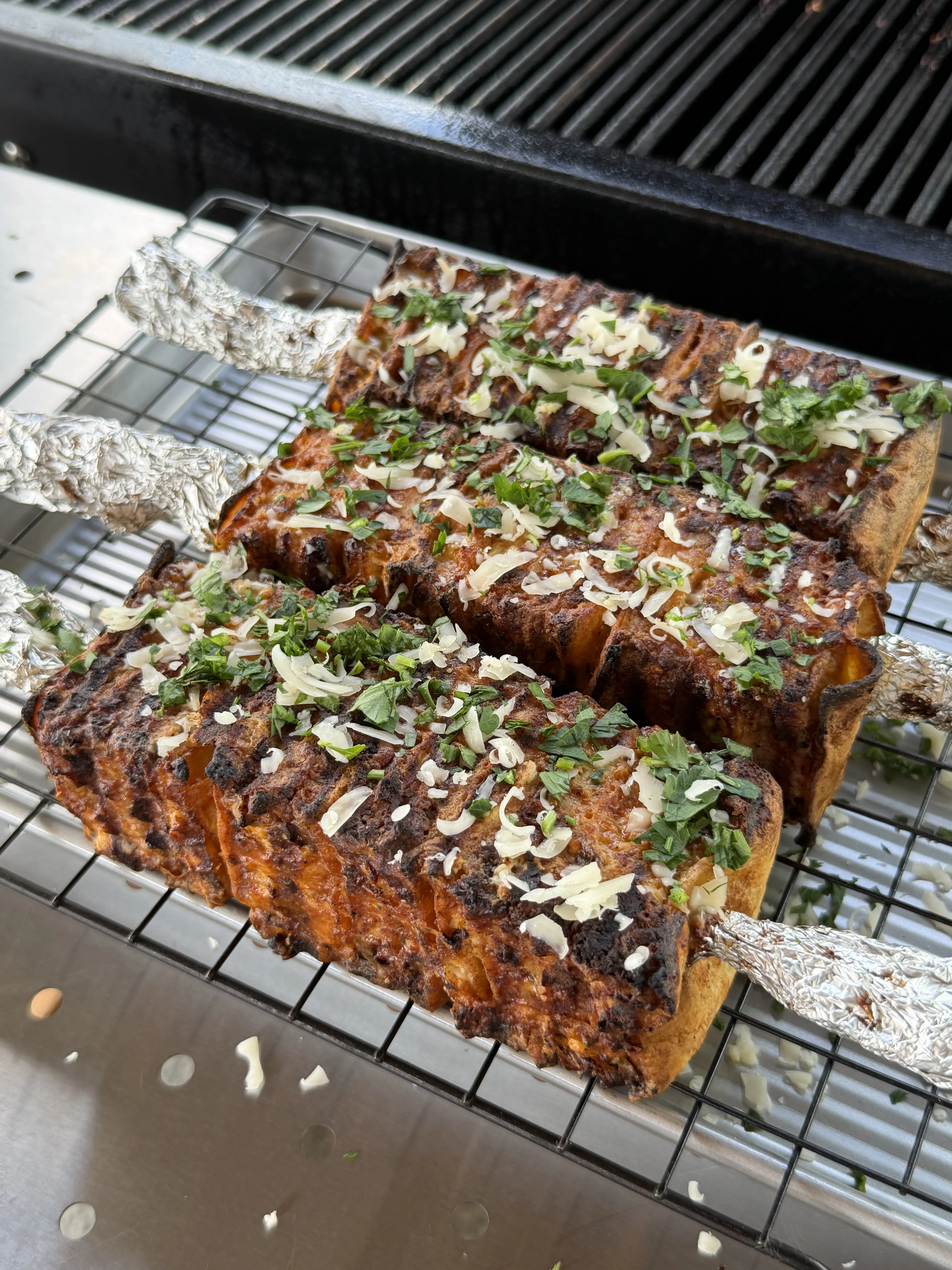 Grilled buffalo chicken tortilla kebabs garnished with ranch, scallions, and blue cheese