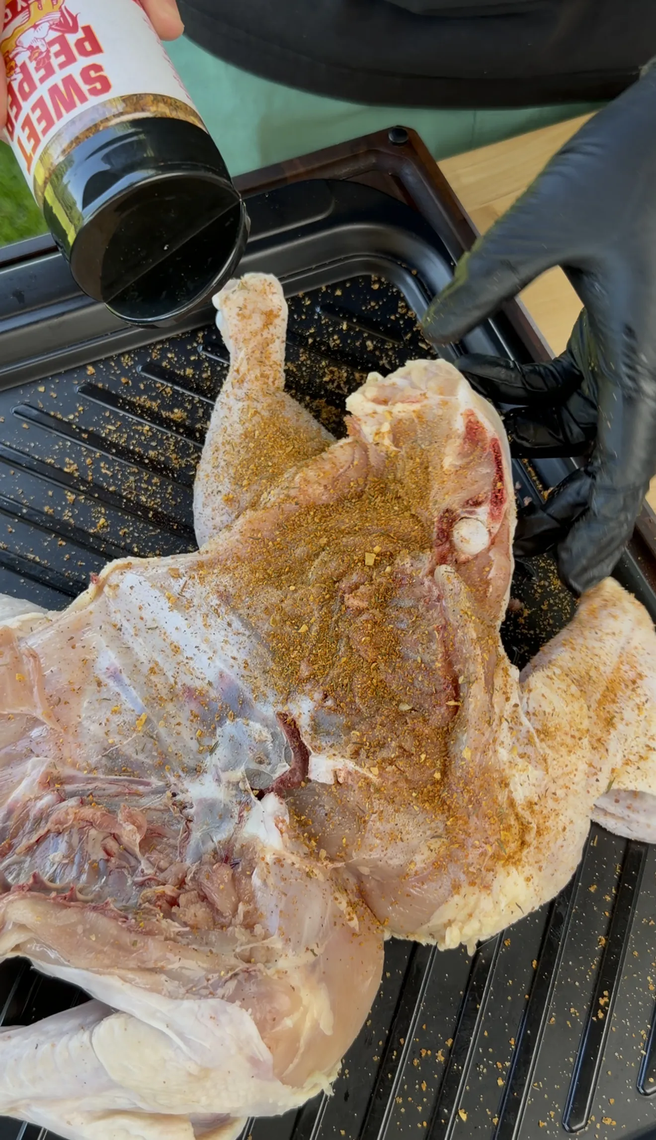 Spatchcocked chicken seasoned with salt, pepper, garlic powder, onion powder, and paprika