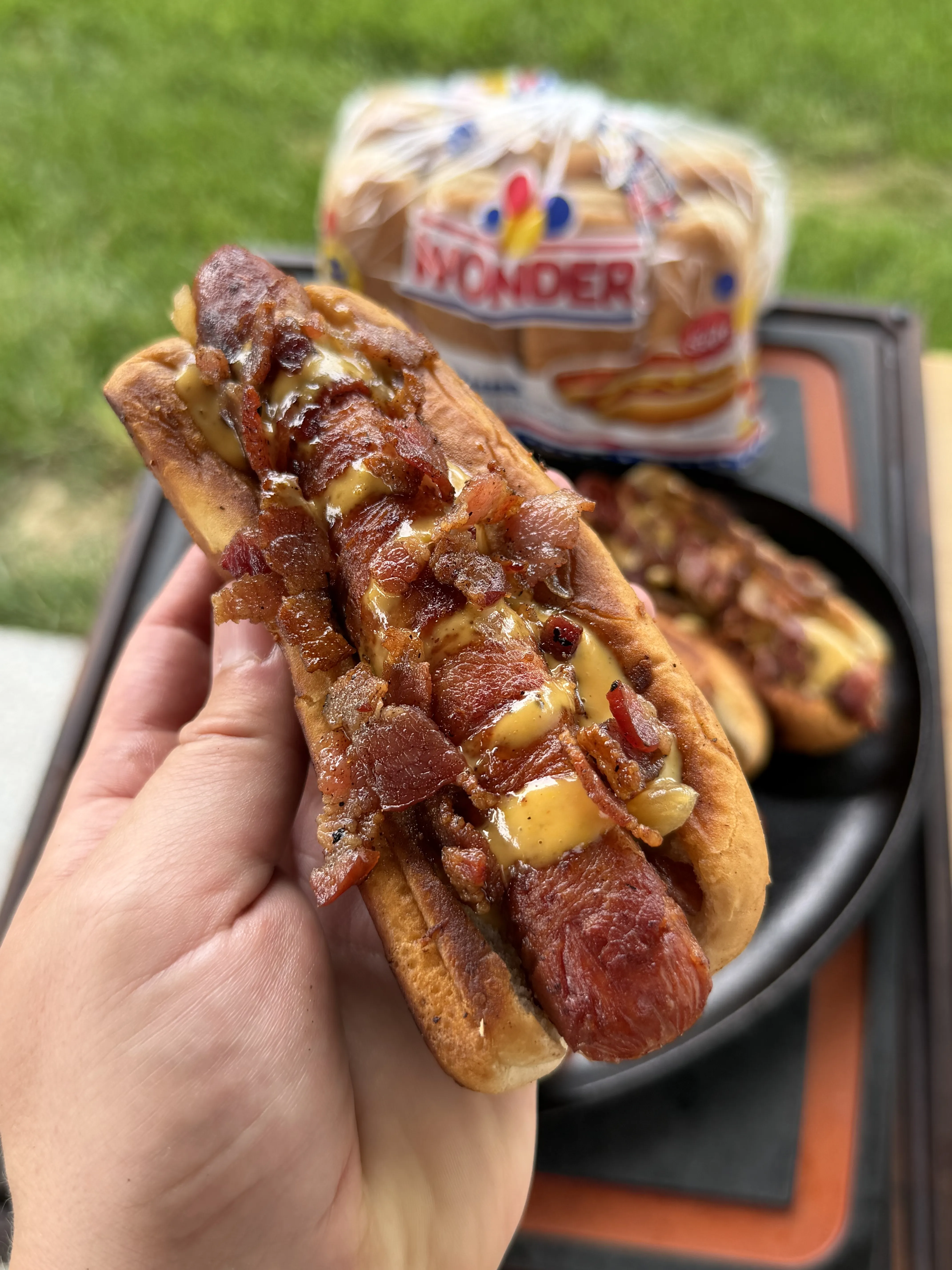 Bacon wrapped hot dog loaded with crispy bacon and creamy Loaded Baconnaise Sauce