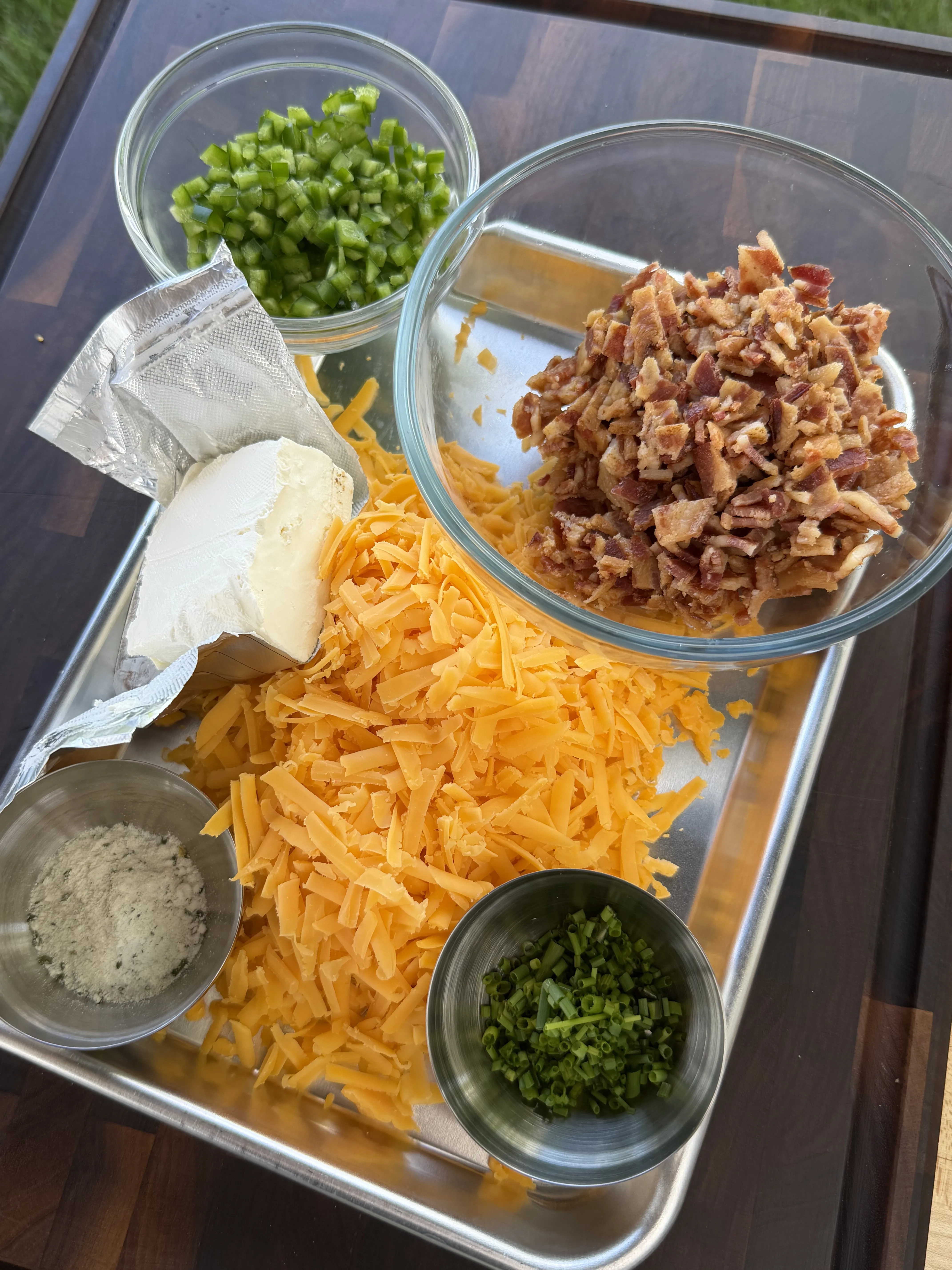 Shredded cheddar, cream cheese, crumbled bacon, jalapenos, chives, and ranch seasoning for the filling