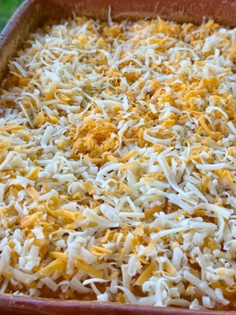 Shredded cheese added to No-Bake Smoked Mac and Cheese before the final cook