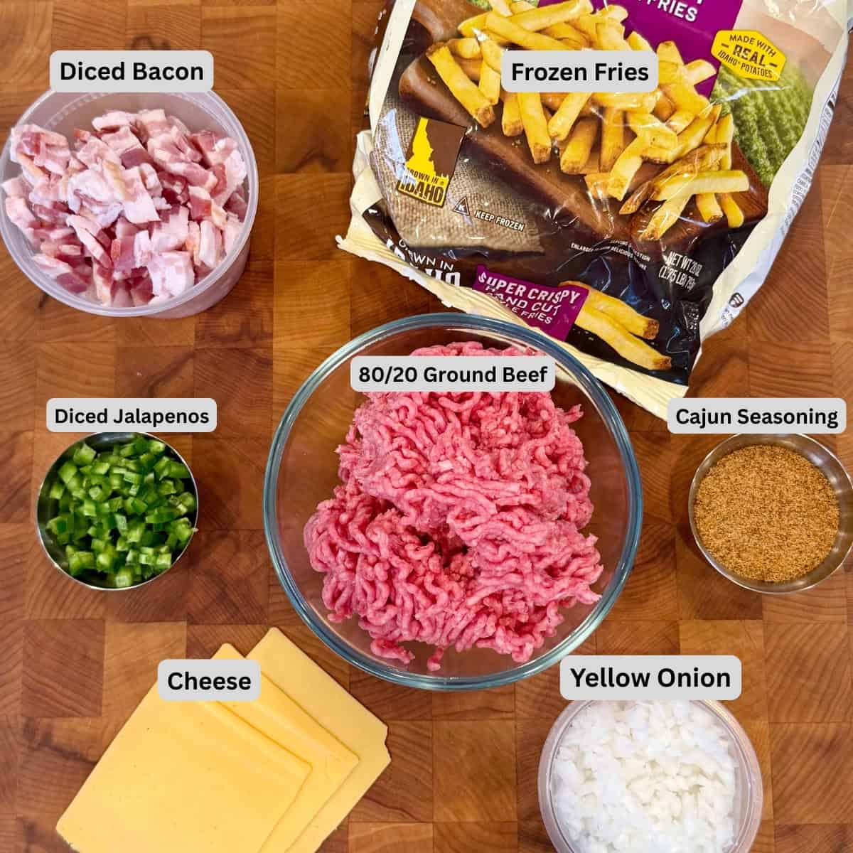 Labeled ingredients for Bacon Cheeseburger Loaded Fries with ground beef, bacon, frozen fries, jalapeños, onion, cheese and Cajun seasoning