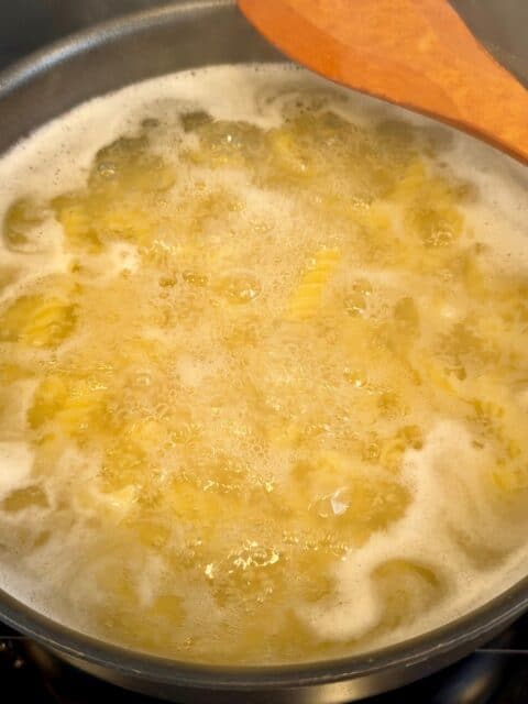 Rotini pasta boiling in salted water for Chicken Bacon Ranch Pasta Salad