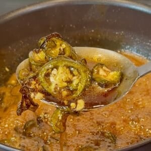 Smoked cowboy candy jalapeños coated in a sticky apricot glaze