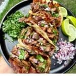 Grilled steak tacos with skirt steak, crispy Oaxaca cheese, red onion, cilantro, fresh lime