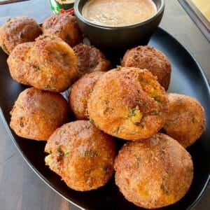 Cajun cheese-stuffed potato croquettes served with homemade comeback sauce