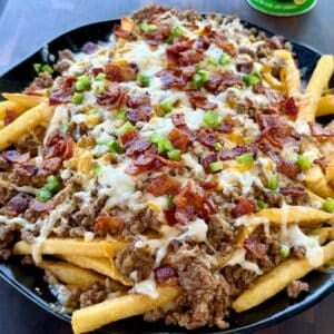 Bacon Cheeseburger Loaded Fries with ground beef, melted cheese, crispy bacon and diced jalapeños
