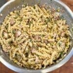 Mexican street corn pasta salad with grilled chicken, corn, cotija cheese, and creamy chili lime sauce