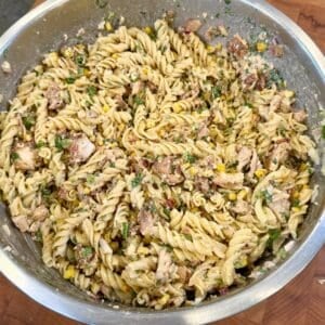 Mexican street corn pasta salad with grilled chicken, corn, cotija cheese, and creamy chili lime sauce