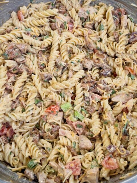 Chicken Bacon Ranch Pasta Salad tossed with grilled chicken, bacon, cheese, tomatoes, and homemade ranch