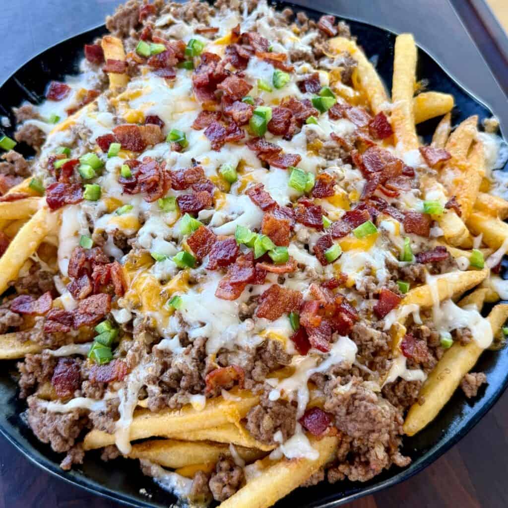Bacon Cheeseburger Loaded Fries with ground beef, melted cheese, crispy bacon and jalapeños