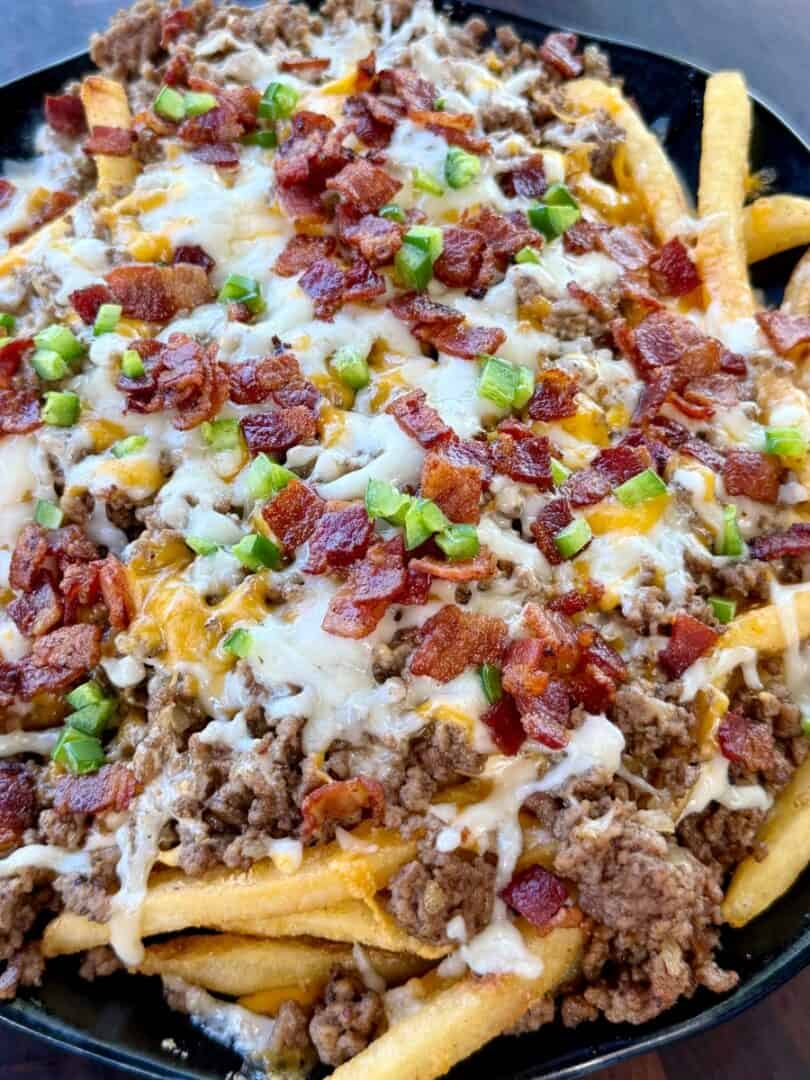 Bacon Cheeseburger Loaded Fries with ground beef, melted cheese, crispy bacon and jalapeños