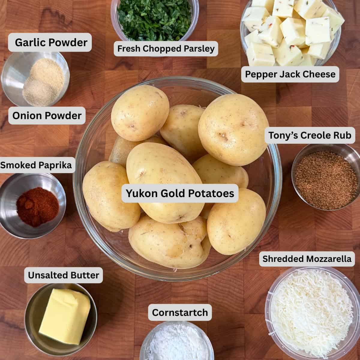 Ingredients for Cajun cheese-stuffed potato croquettes with Yukon Gold potatoes, pepper jack cheese, shredded mozzarella, Creole seasoning, and spices