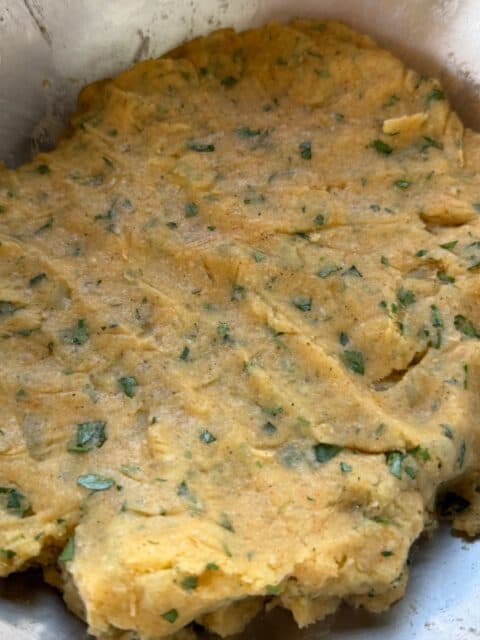 Riced Yukon Gold potato mixture seasoned for Cajun cheese-stuffed croquettes