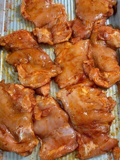 chicken thighs ready to grill for Mexican street corn pasta salad