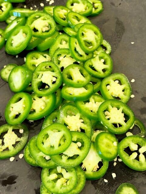 Fresh jalapeños sliced into rounds for smoked cowboy candy