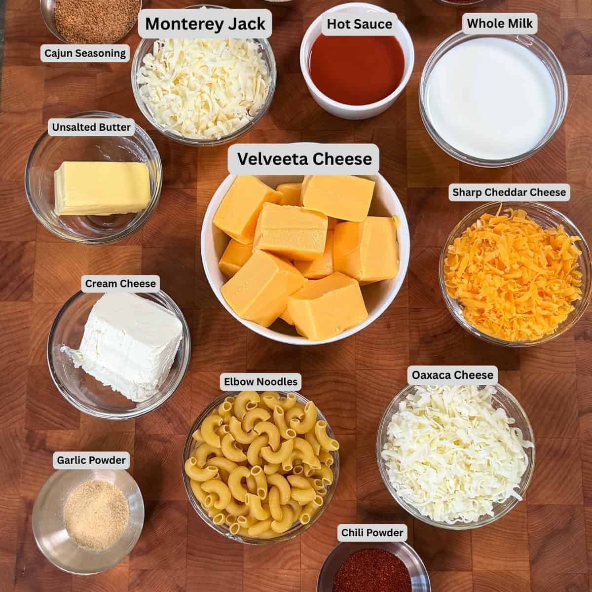 Labeled ingredients for No-Bake Smoked Mac and Cheese with Velveeta, cheddar, Monterey Jack and Oaxaca cheese