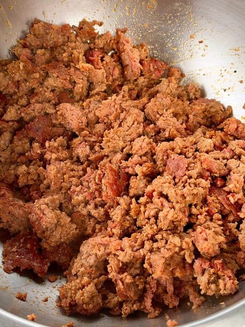Smoked ground chuck and Italian sausage loaf broken into bite-sized pieces for chili.